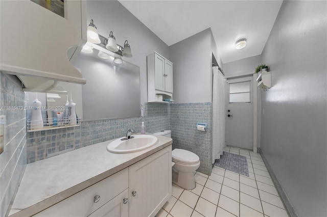 8331 NW 18th St, Pembroke Pines, FL 33024 - bathroom featuring tile patterned flooring, vanity, tile walls, a shower with shower curtain, and a wainscoted wall