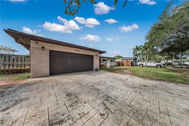 8331 NW 18th St, Pembroke Pines, FL 33024 - view of front facade featuring an attached garage and decorative driveway