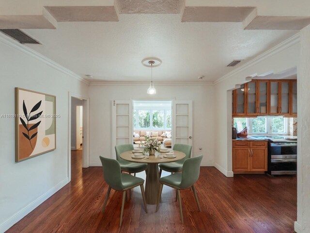 1036 Palermo Ave, Coral Gables, FL 33134 - dining area with dark wood-style floors and crown molding
