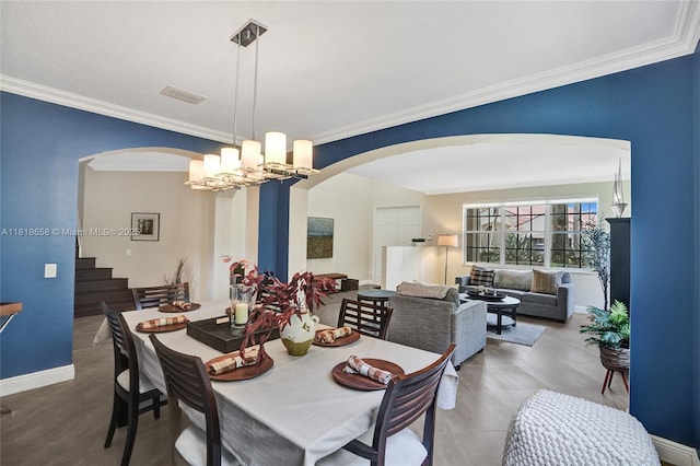 2509 Hunters Run Way, Weston, FL 33327 - dining space with arched walkways, crown molding, a chandelier, and stairway