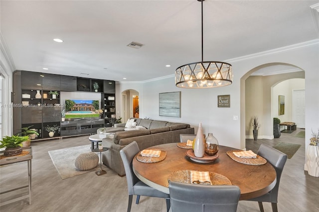 2509 Hunters Run Way, Weston, FL 33327 - dining space featuring arched walkways, ornamental molding, recessed lighting, and a chandelier