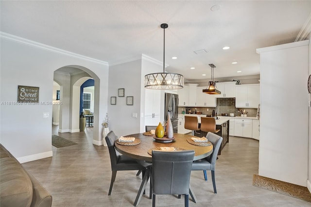 2509 Hunters Run Way, Weston, FL 33327 - dining area featuring crown molding, recessed lighting, arched walkways, and finished concrete flooring