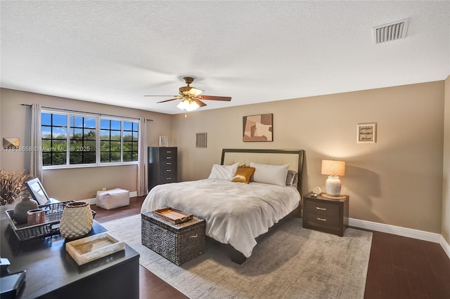 2509 Hunters Run Way, Weston, FL 33327 - bedroom featuring dark wood finished floors, ceiling fan, and a textured ceiling