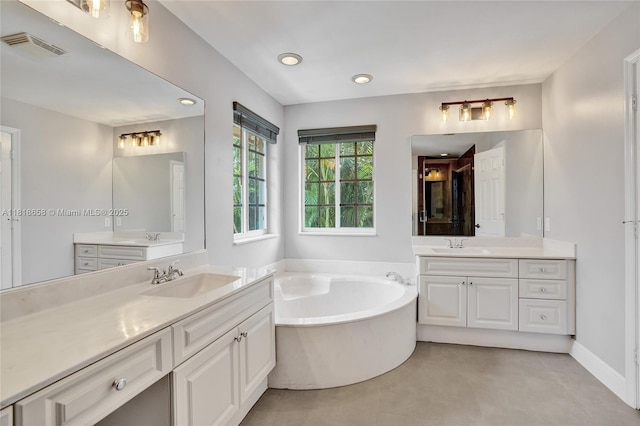 2509 Hunters Run Way, Weston, FL 33327 - full bathroom with two vanities, a bath, tile patterned floors, and recessed lighting