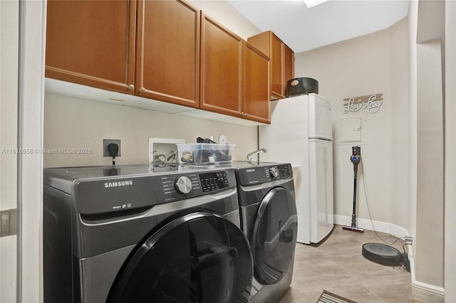 2509 Hunters Run Way, Weston, FL 33327 - laundry area featuring cabinet space and washing machine and clothes dryer