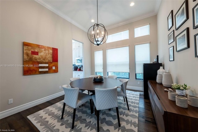 9368 Eden Roc Ct, Delray Beach, FL 33446 - dining room with crown molding, a chandelier, baseboards, dark wood-type flooring, and recessed lighting