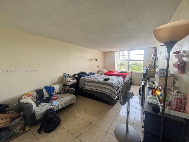 498 NW 165th St Rd Unit D-405, Miami, FL 33169 - bedroom featuring light tile patterned floors and a textured ceiling