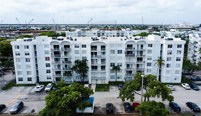498 NW 165th St Rd Unit D-405, Miami, FL 33169 - view of apartment building / complex with uncovered parking