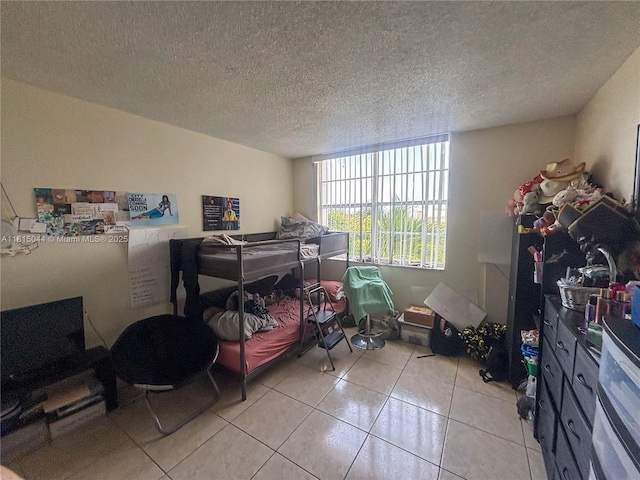 498 NW 165th St Rd Unit D-405, Miami, FL 33169 - bedroom with light tile patterned floors and a textured ceiling