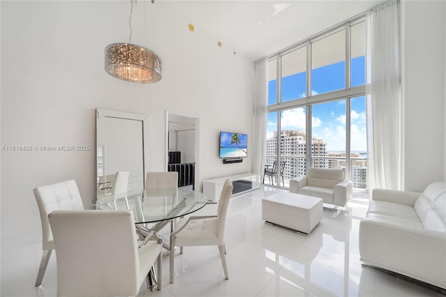 475 Brickell Ave Unit 2807, Miami, FL 33131 - dining room with a towering ceiling and tile patterned floors