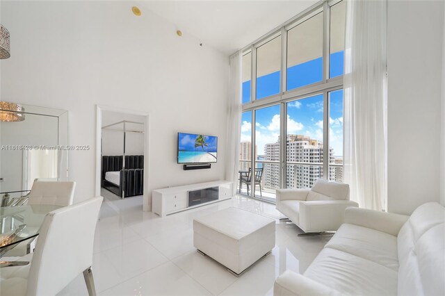 475 Brickell Ave Unit 2807, Miami, FL 33131 - living room with a towering ceiling and light tile patterned flooring