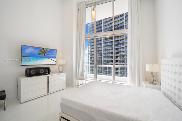475 Brickell Ave Unit 2807, Miami, FL 33131 - bedroom featuring tile patterned flooring