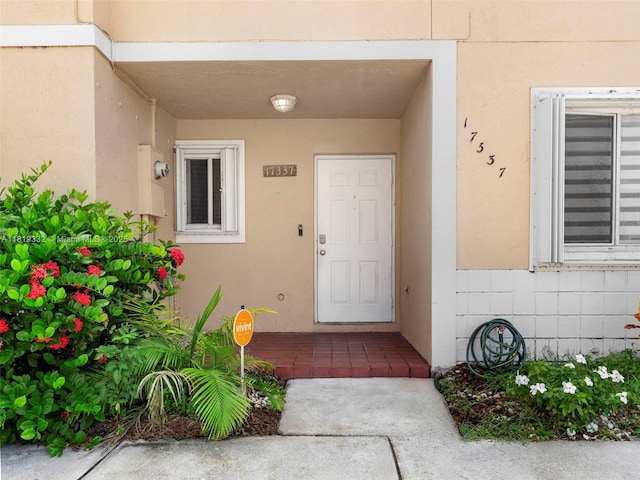 17337 SW 140th Ct, Miami, FL 33177 - doorway to property with stucco siding