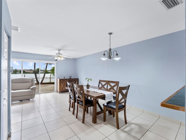 17337 SW 140th Ct, Miami, FL 33177 - dining area featuring a chandelier, a water view, light tile patterned flooring, and ceiling fan