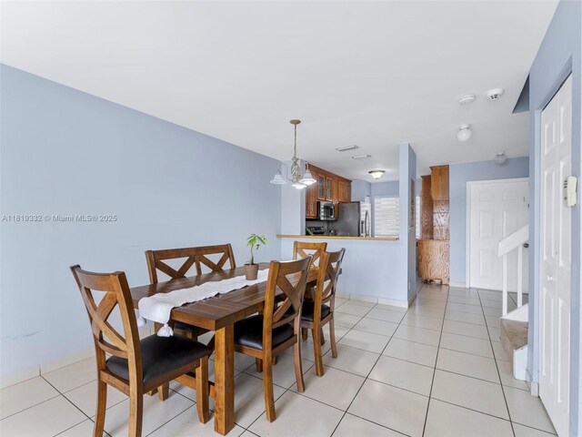 17337 SW 140th Ct, Miami, FL 33177 - dining room with light tile patterned floors and a chandelier