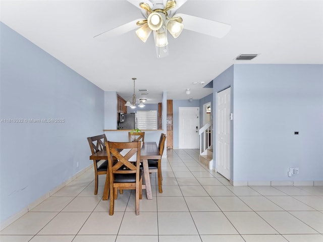 17337 SW 140th Ct, Miami, FL 33177 - dining space featuring a ceiling fan, stairway, baseboards, and light tile patterned flooring