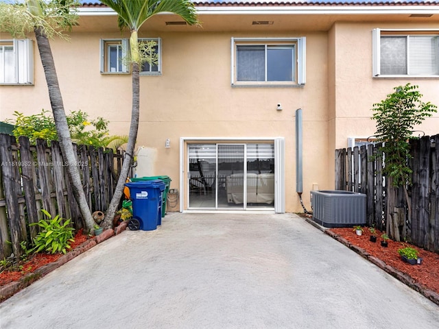 17337 SW 140th Ct, Miami, FL 33177 - back of property with stucco siding, central AC unit, and a patio