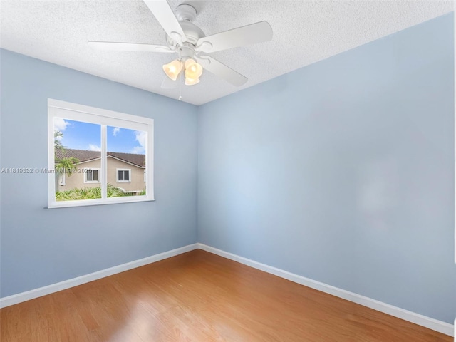 17337 SW 140th Ct, Miami, FL 33177 - unfurnished room with wood finished floors, baseboards, a textured ceiling, and ceiling fan