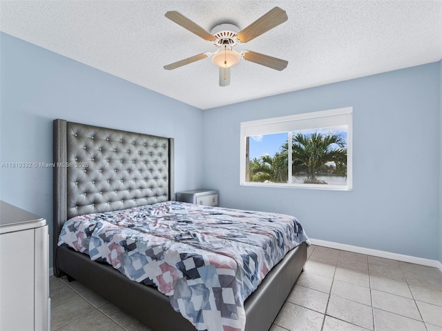 17337 SW 140th Ct, Miami, FL 33177 - bedroom featuring baseboards, a textured ceiling, tile patterned floors, and ceiling fan