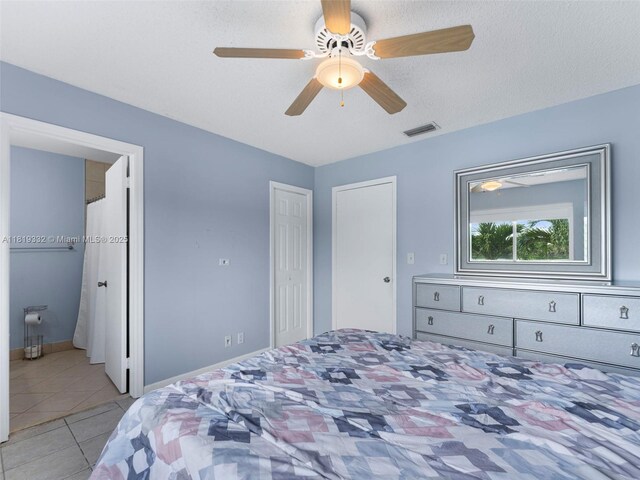 17337 SW 140th Ct, Miami, FL 33177 - bedroom with light tile patterned flooring, a ceiling fan, and baseboards