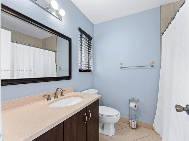 17337 SW 140th Ct, Miami, FL 33177 - bathroom with toilet, vanity, tile patterned flooring, curtained shower, and baseboards
