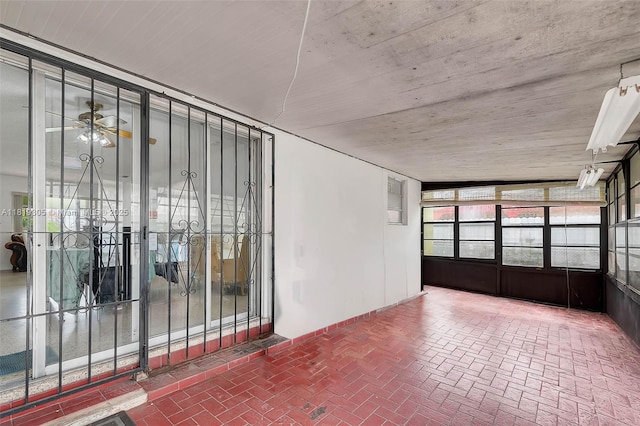 1150 W 69th Pl, Hialeah, FL 33014 - unfurnished sunroom featuring a ceiling fan
