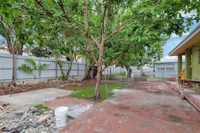 1150 W 69th Pl, Hialeah, FL 33014 - fenced backyard featuring a patio