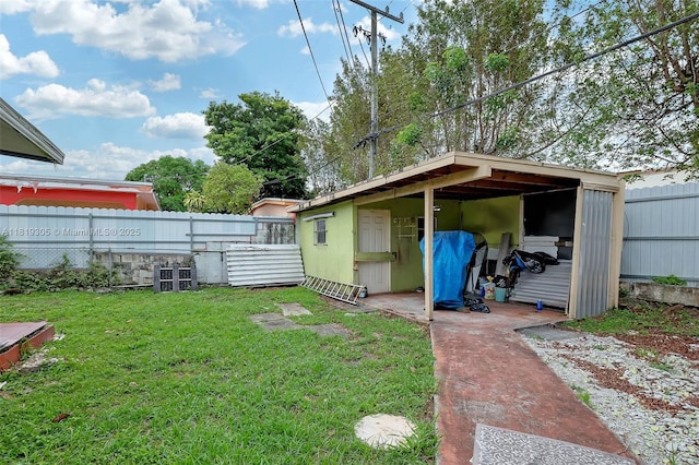 1150 W 69th Pl, Hialeah, FL 33014 - view of yard with an outdoor structure