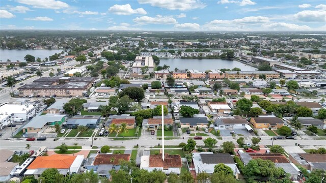 1150 W 69th Pl, Hialeah, FL 33014 - aerial perspective of suburban area featuring a large body of water