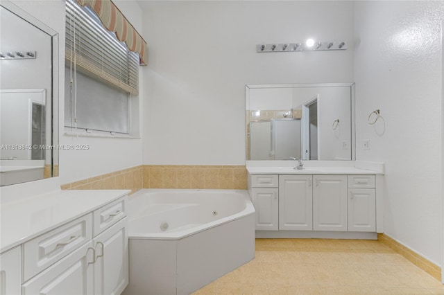 13148 SW 23rd St, Miramar, FL 33027 - full bath with two vanities, a tub with jets, a stall shower, and tile patterned flooring