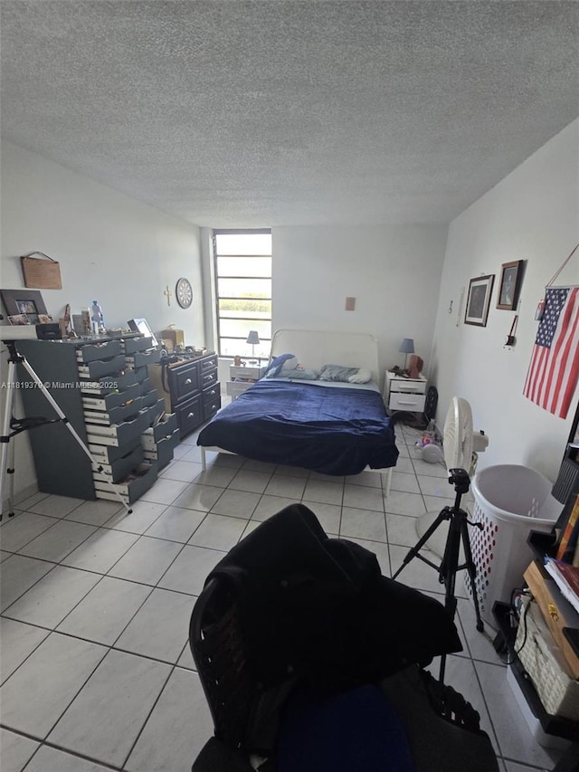 9688 Fontainebleau Blvd Unit 409, Miami, FL 33172 - bedroom featuring light tile patterned floors and a textured ceiling