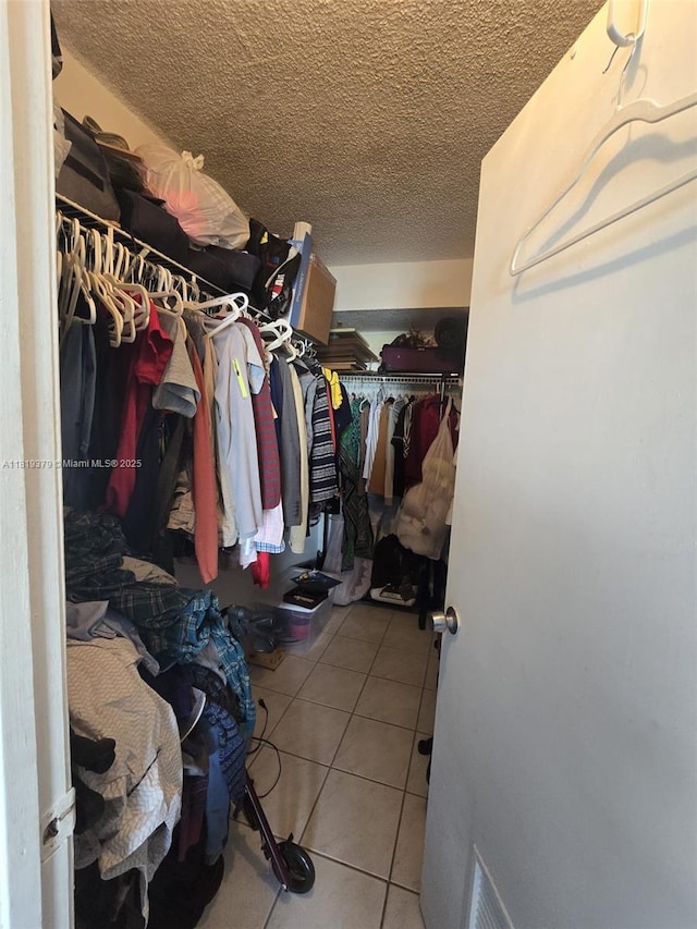 9688 Fontainebleau Blvd Unit 409, Miami, FL 33172 - walk in closet with tile patterned flooring