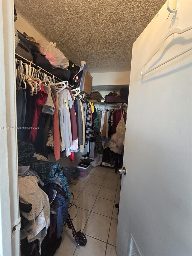 9688 Fontainebleau Blvd Unit 409, Miami, FL 33172 - spacious closet with tile patterned flooring