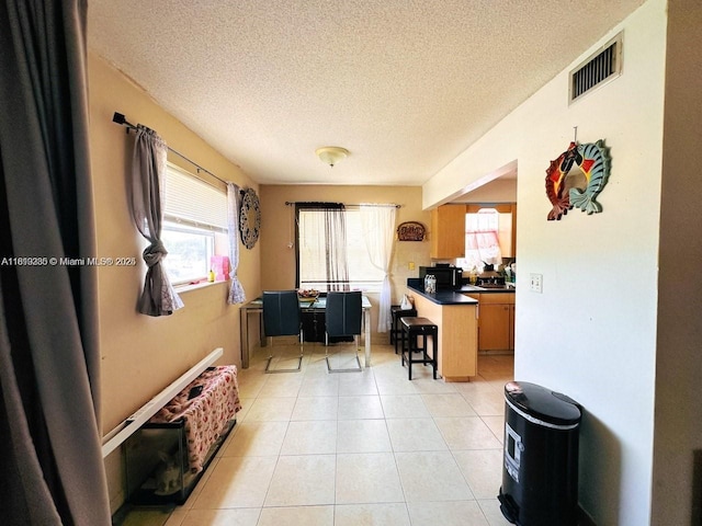 2420 Johnson St Unit 202, Hollywood, FL 33020 - office area featuring plenty of natural light, a textured ceiling, and light tile patterned floors