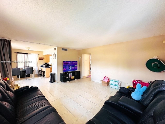 2420 Johnson St Unit 202, Hollywood, FL 33020 - living room featuring light tile patterned floors and a textured ceiling