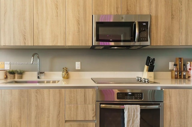 3900 Biscayne Blvd Unit N-1011, Miami, FL 33137 - kitchen with stainless steel appliances, modern cabinets, and a sink