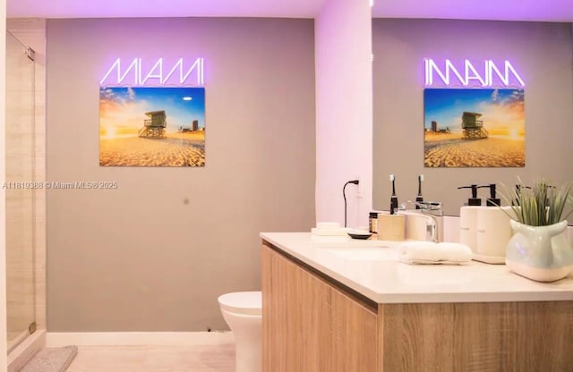 3900 Biscayne Blvd Unit N-1011, Miami, FL 33137 - bathroom with toilet, a shower with door, vanity, and baseboards