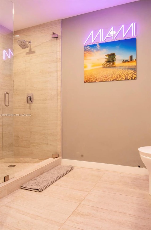 3900 Biscayne Blvd Unit N-1011, Miami, FL 33137 - full bathroom with a stall shower, tile patterned flooring, and baseboards
