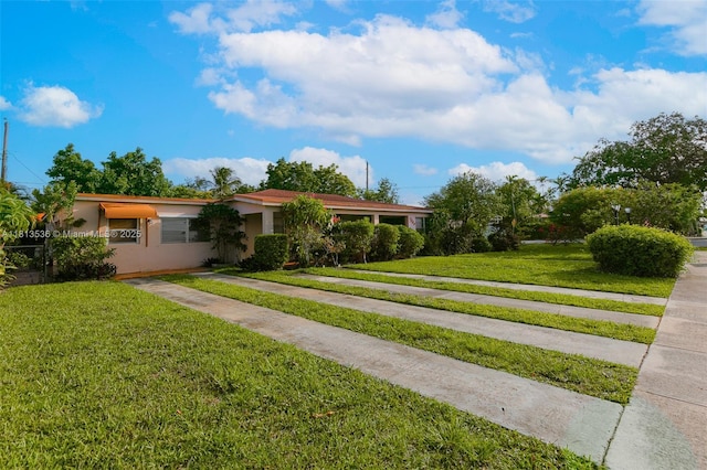 7280 SW 9th St, Miami, FL 33144 - single story home featuring stucco siding and a front lawn