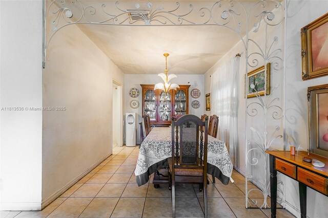 7280 SW 9th St, Miami, FL 33144 - dining area with a chandelier and light tile patterned floors