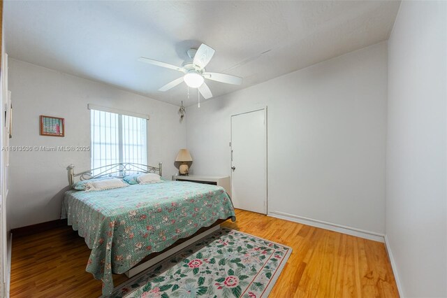 7280 SW 9th St, Miami, FL 33144 - bedroom featuring wood finished floors, ceiling fan, and baseboards