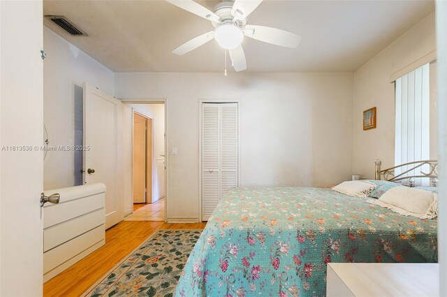 7280 SW 9th St, Miami, FL 33144 - bedroom featuring light wood-style floors, a closet, and ceiling fan