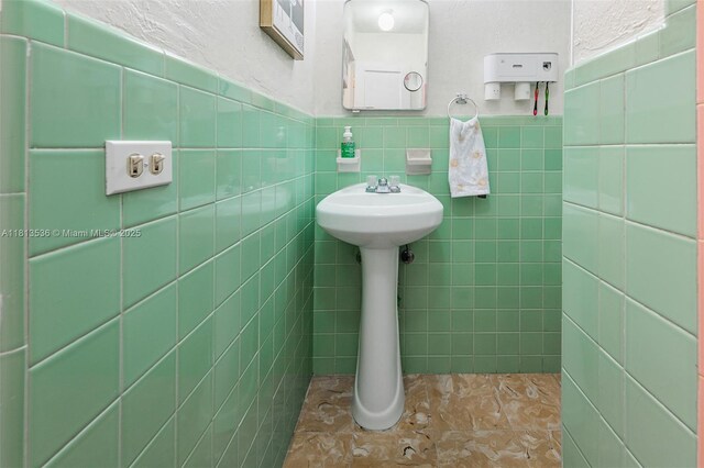 7280 SW 9th St, Miami, FL 33144 - bathroom featuring tile walls and wainscoting
