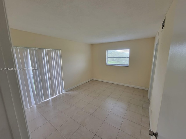 8740 N Sherman Cir Unit 308, Miramar, FL 33025 - spare room with light tile patterned floors