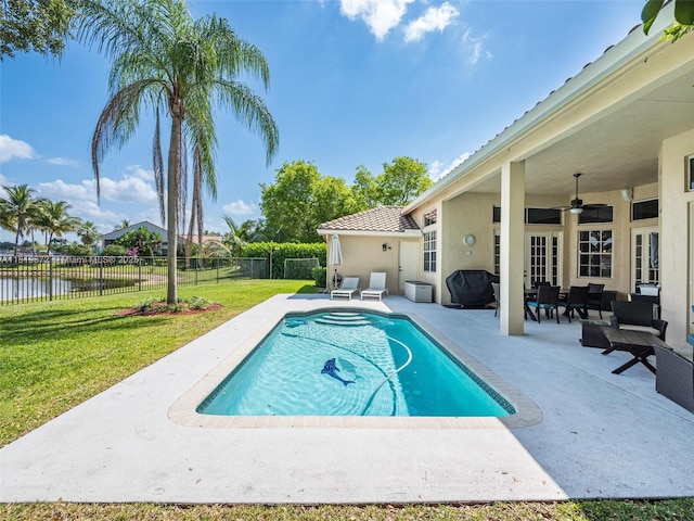 643 Lake Blvd, Weston, FL 33326 - view of pool with a ceiling fan, a patio, a water view, and an outdoor living space