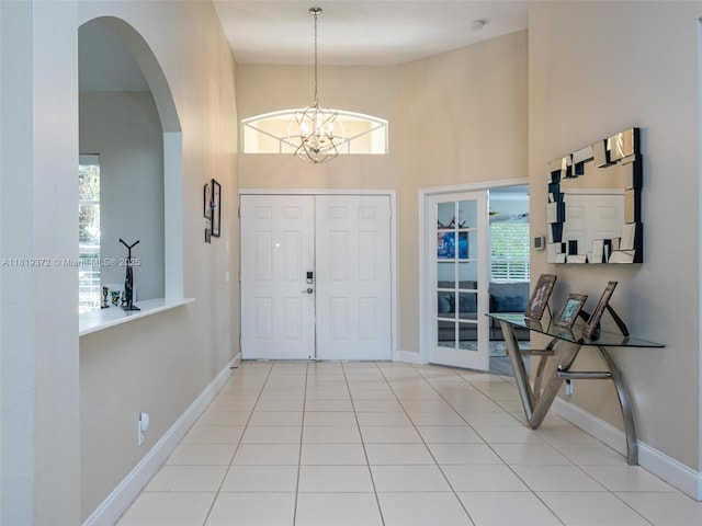 643 Lake Blvd, Weston, FL 33326 - foyer with healthy amount of natural light, a towering ceiling, and baseboards