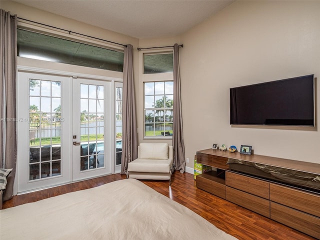 643 Lake Blvd, Weston, FL 33326 - bedroom featuring french doors, access to exterior, and wood finished floors