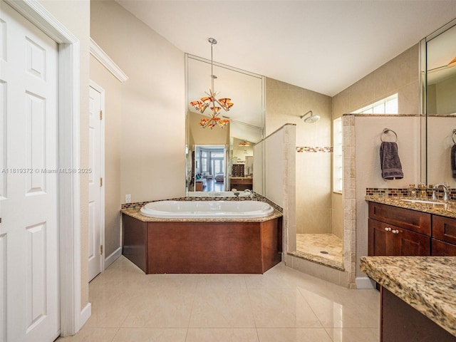 643 Lake Blvd, Weston, FL 33326 - full bath with walk in shower, a bath, lofted ceiling, vanity, and tile patterned flooring