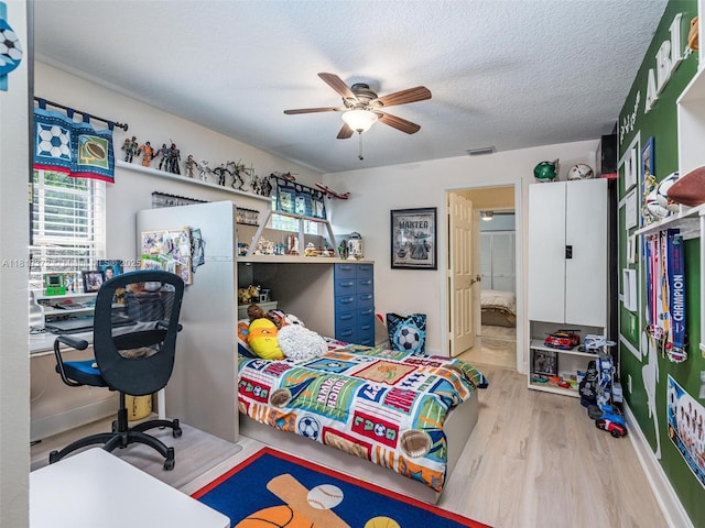 643 Lake Blvd, Weston, FL 33326 - bedroom featuring multiple windows, wood finished floors, ceiling fan, and an office area