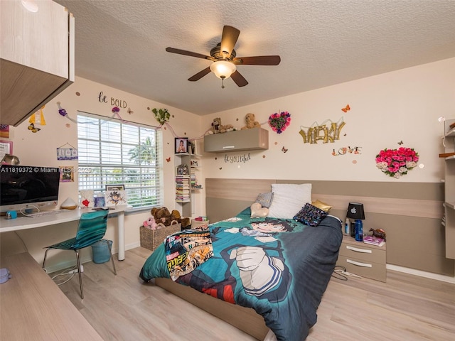 643 Lake Blvd, Weston, FL 33326 - bedroom with wood finished floors, a textured ceiling, baseboards, and a ceiling fan